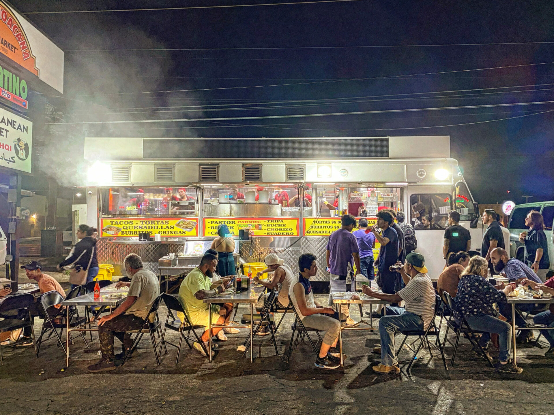 Identity Productions - People gather outside a food truck on Austin's Taco Mile.