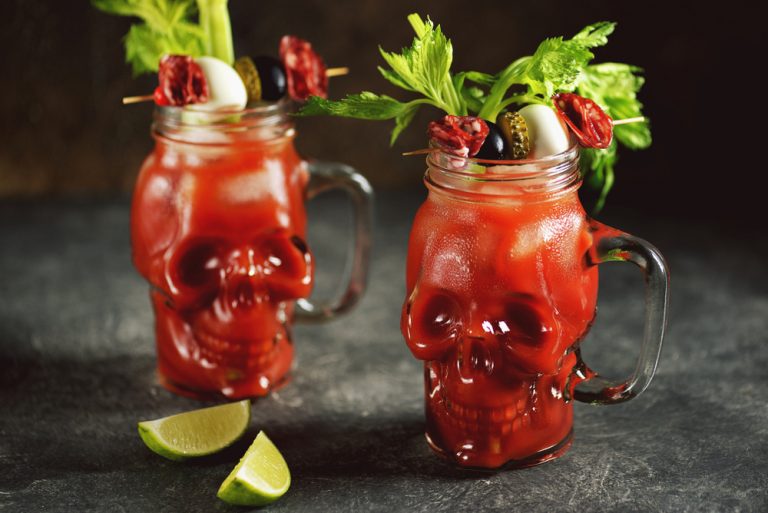 Bloody,Mary,Cocktail,In,Glass,Skull,With,Celery,Sticks,,Pink