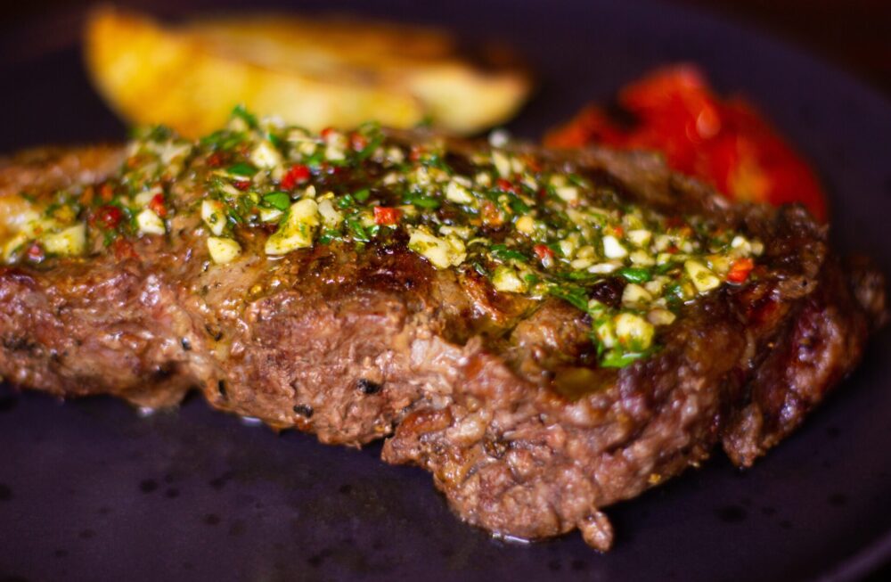 Argentine,Barbeque,Steak,With,Chimichurri,,Potatoes,And,Grilled,Vegetables