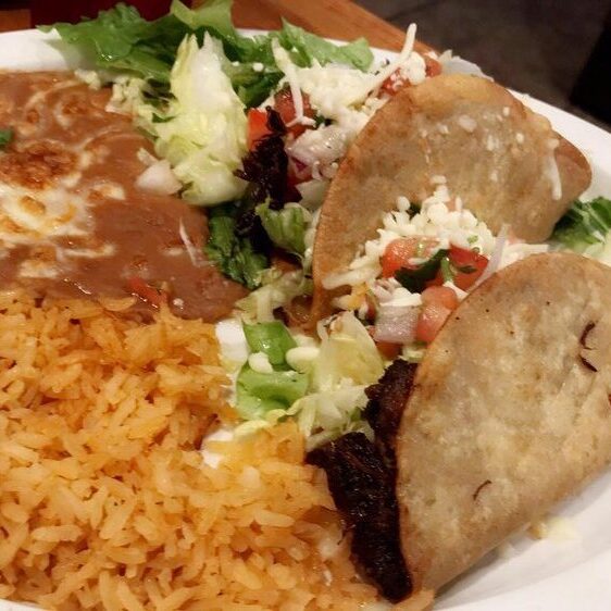 Crispy taco plate with beans and rice