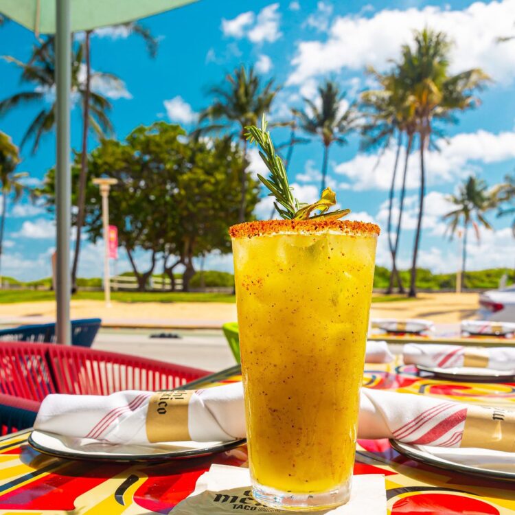 Kiwi Margarita on Patio with Palm Tree View