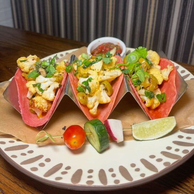3 Cauliflower tacos on red tortillas