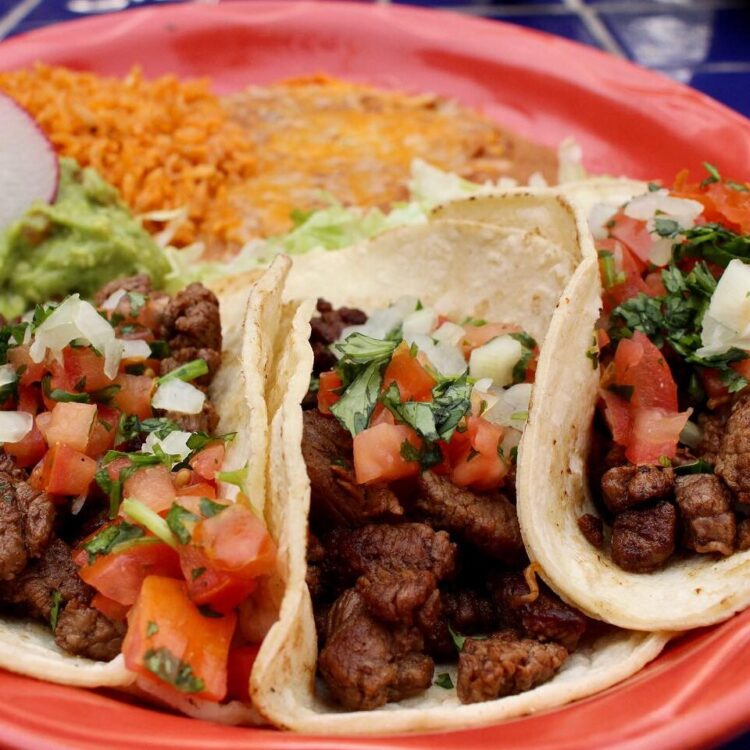 Carne Asada tacos with rice and beans