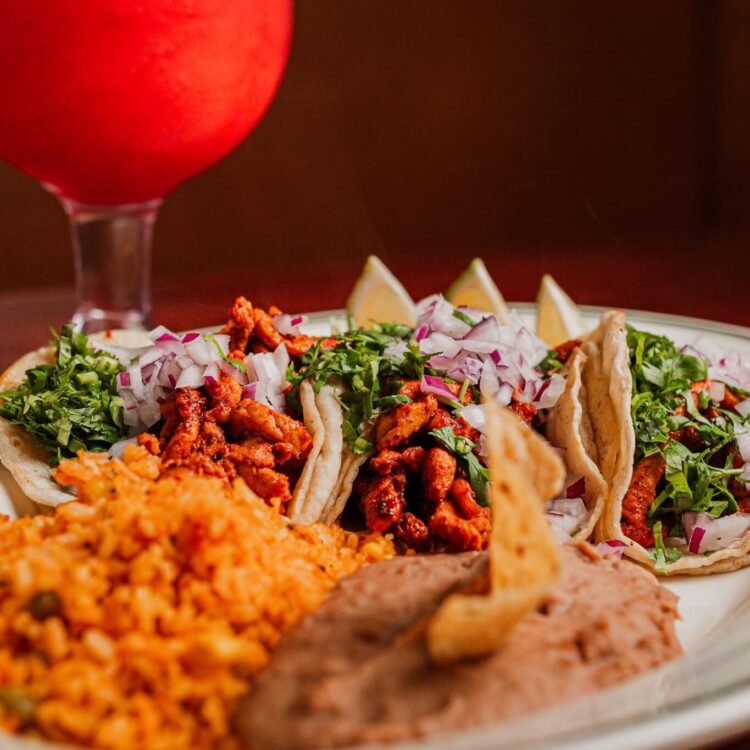 Carnitas tacos and strawberry margarita