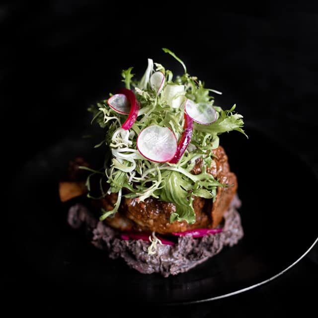 Cochinita Pibil - Guerrero style pork shank black bean purée pickled red onions and habanero salsa Served with corn tortillas