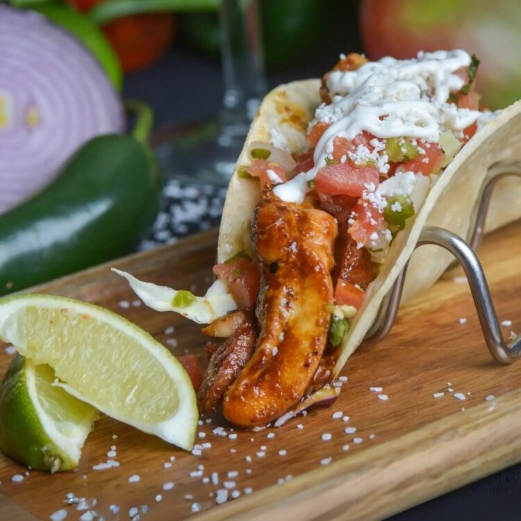 POLLO + MOLE - Marinated grilled chicken topped with mole poblano crema pico de gallo cabbage and queso fresco