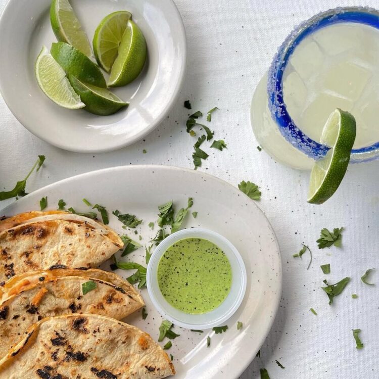 Quesadill and paloma with different salsas