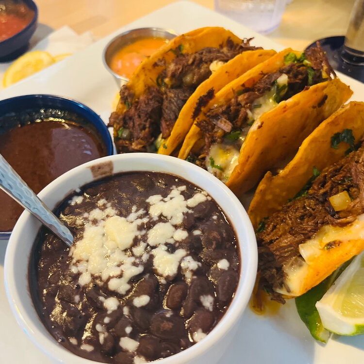 Tacos Birria with side of beans