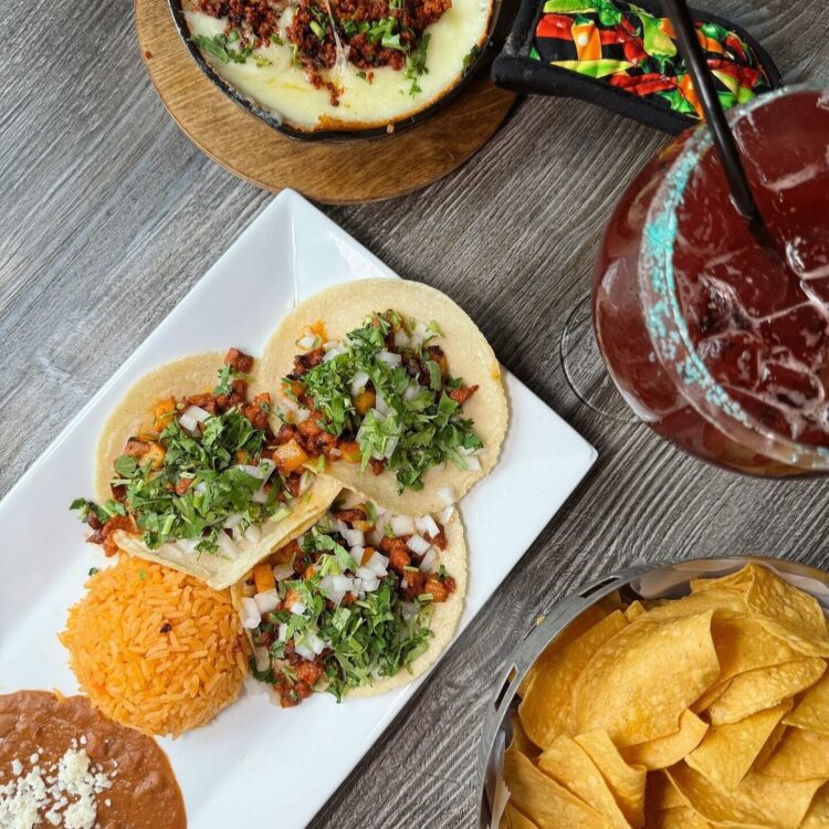 Tacos al pastor chips queso and margarita
