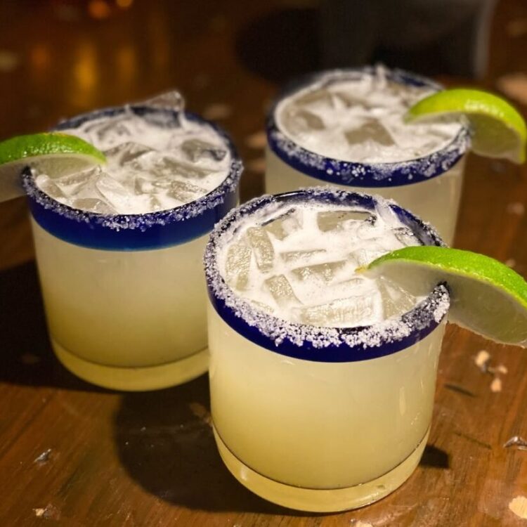 3 Classic Margaritas with salt rim and lime wedge
