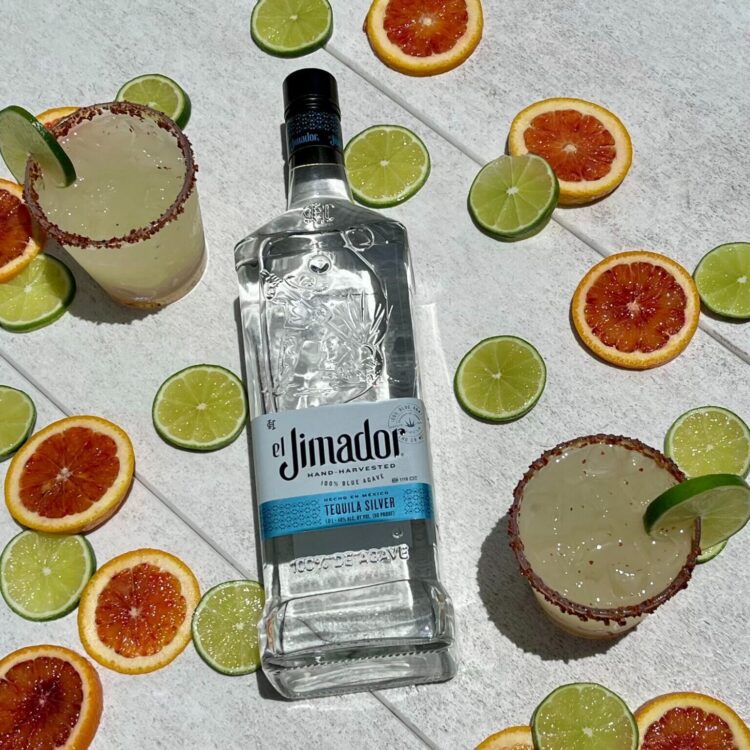 Jimador bottle and margaritas with lime and blood orange slices