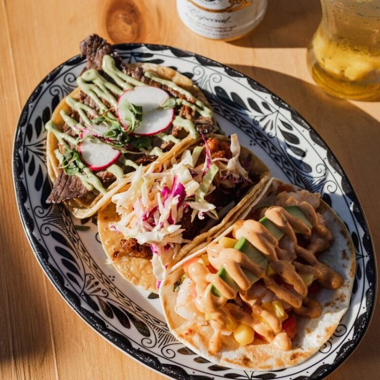 Plate of 3 tacos and a beer