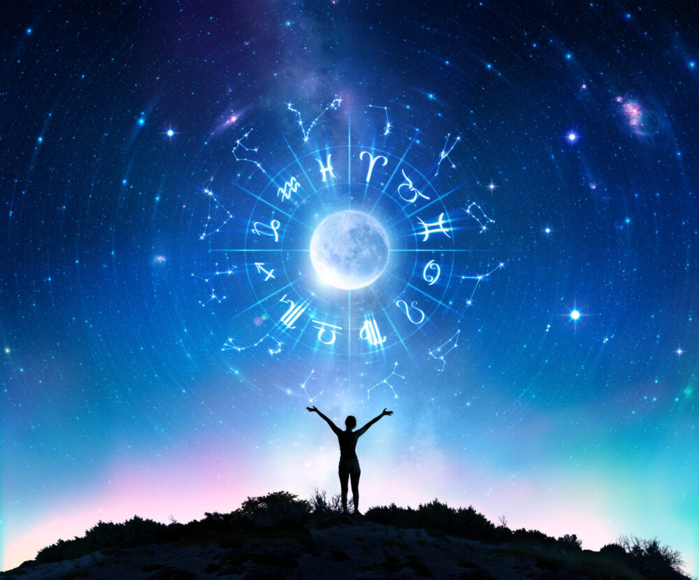 WomanConsultingTheStars-ZodiacSignsInTheSky