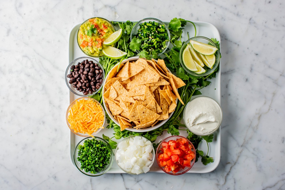 Nachos.,Crispy,Tortilla,Chips,Topped,With,Melted,Cheddar,Cheese,,Salsa,