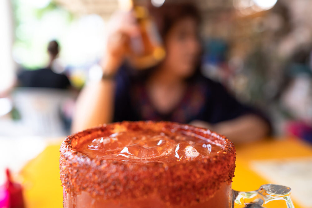 The,Michelada,Glass,Has,A,Lot,Of,Ice,And,Condiments.