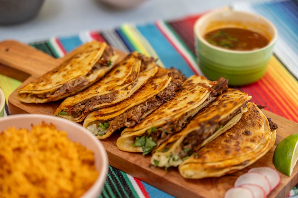 Studio,Style,Photo,Of,Quesabirria,Tacos,On,Colorful,Serape,With
