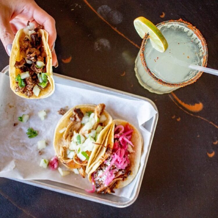 Eating street Tacos and a margarita