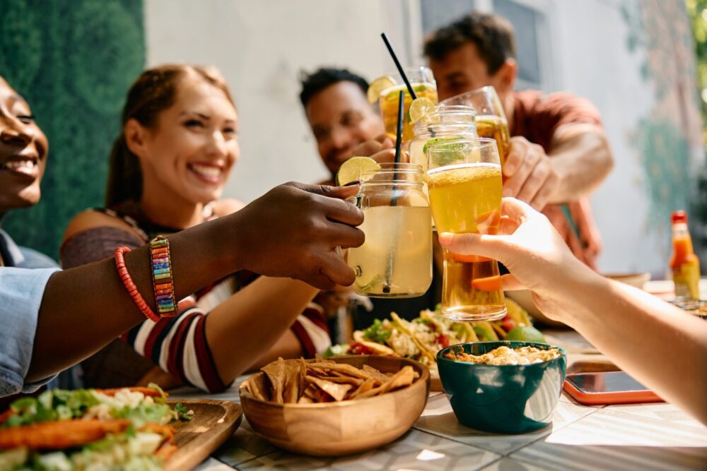 Close,Up,Of,Group,Of,Friends,Celebrating,And,Toasting,During