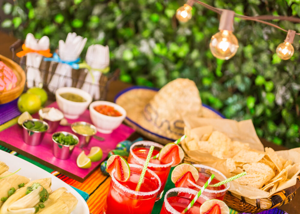Party,Table,With,Tamales,,Strawberry,Margartisa,And,Pan,Dulche,Bread.
