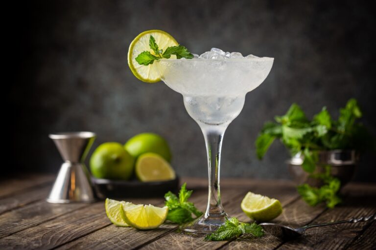 Cocktail,Margarita,Garnished,With,Lime,And,Mint,On,Wooden,Background