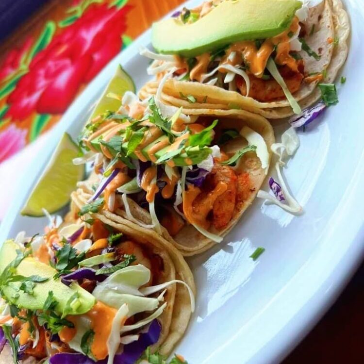 Fish Tacos (3) topped with cabbage slaw, avocado & Chipotle salsa