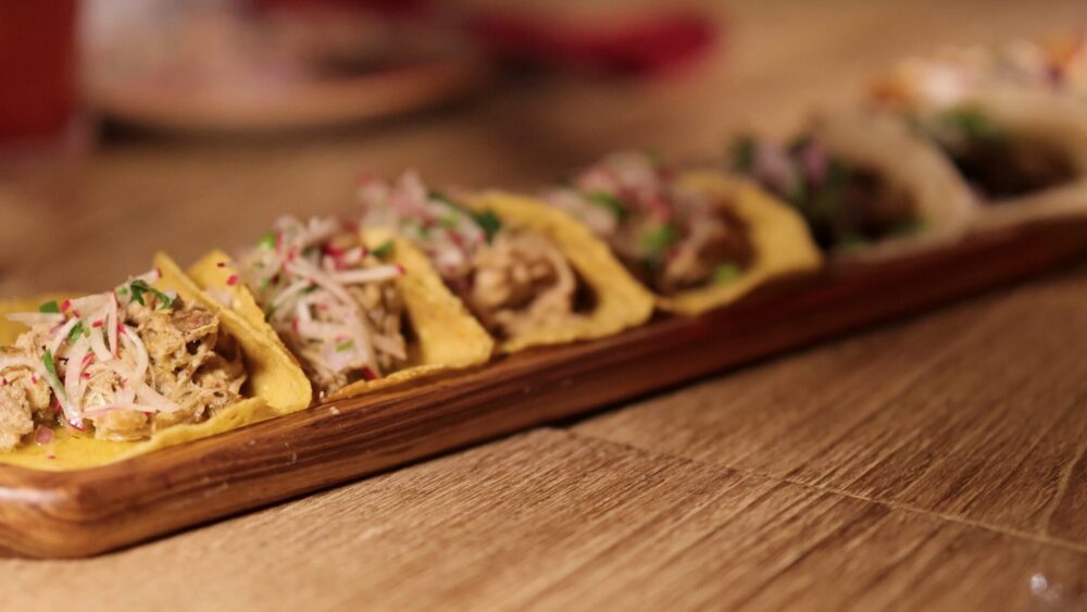 A,Series,Of,Colorful,Tacos,With,Radish,And,Cilantro,Garnishes