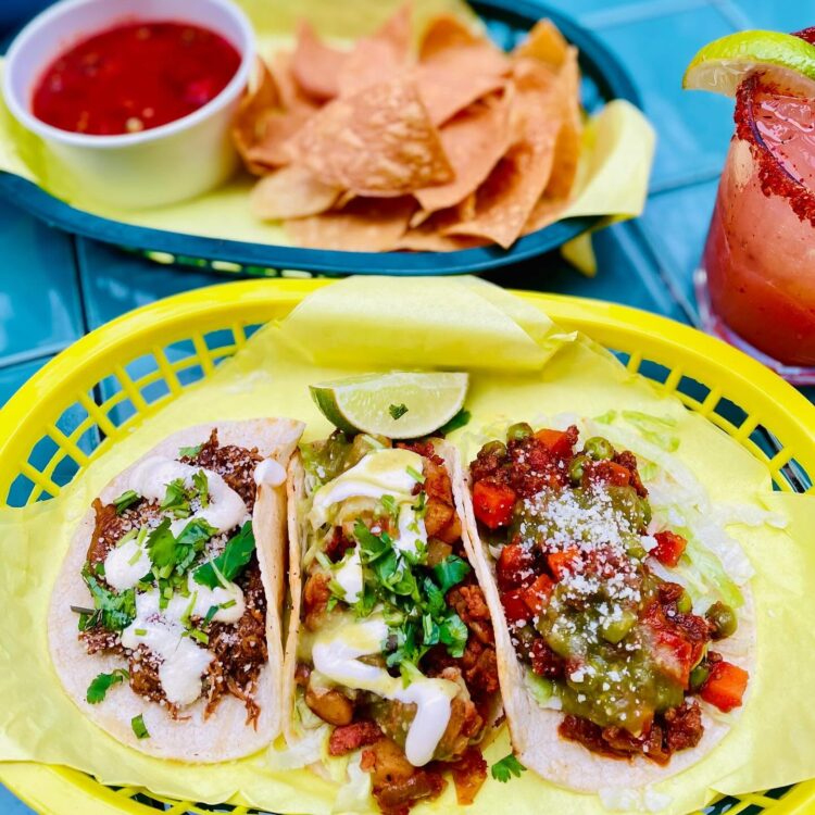 Three tacos with chips and salsa, margarita