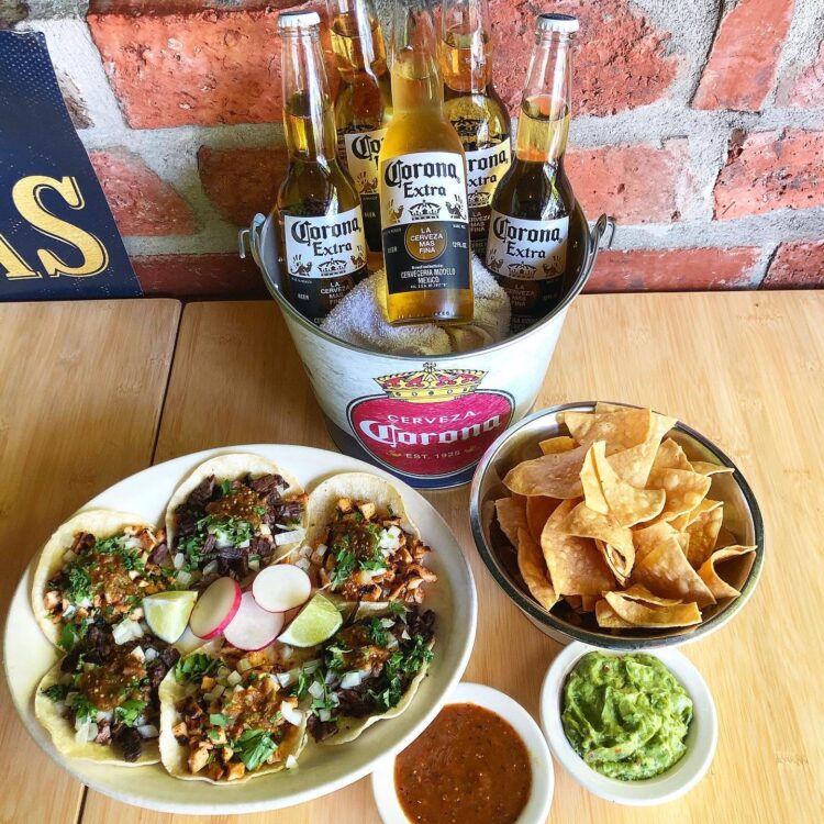 Tacos, chips, guacamole and bucket of beer