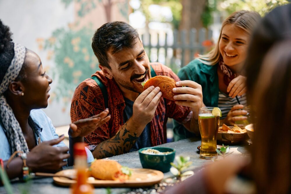 Group,Of,Friends,Eating,Mexican,Food,In,A,Restaurant.,Focus