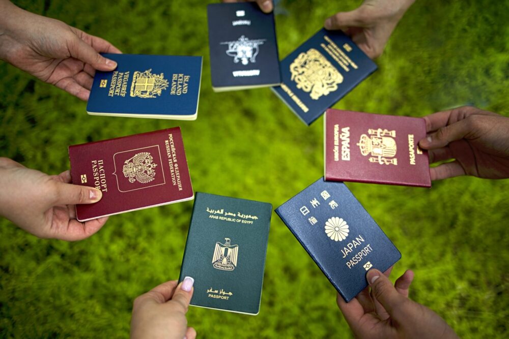 Diverse,Hands,Display,Multiple,International,Passports,In,A,Circular,Arrangement
